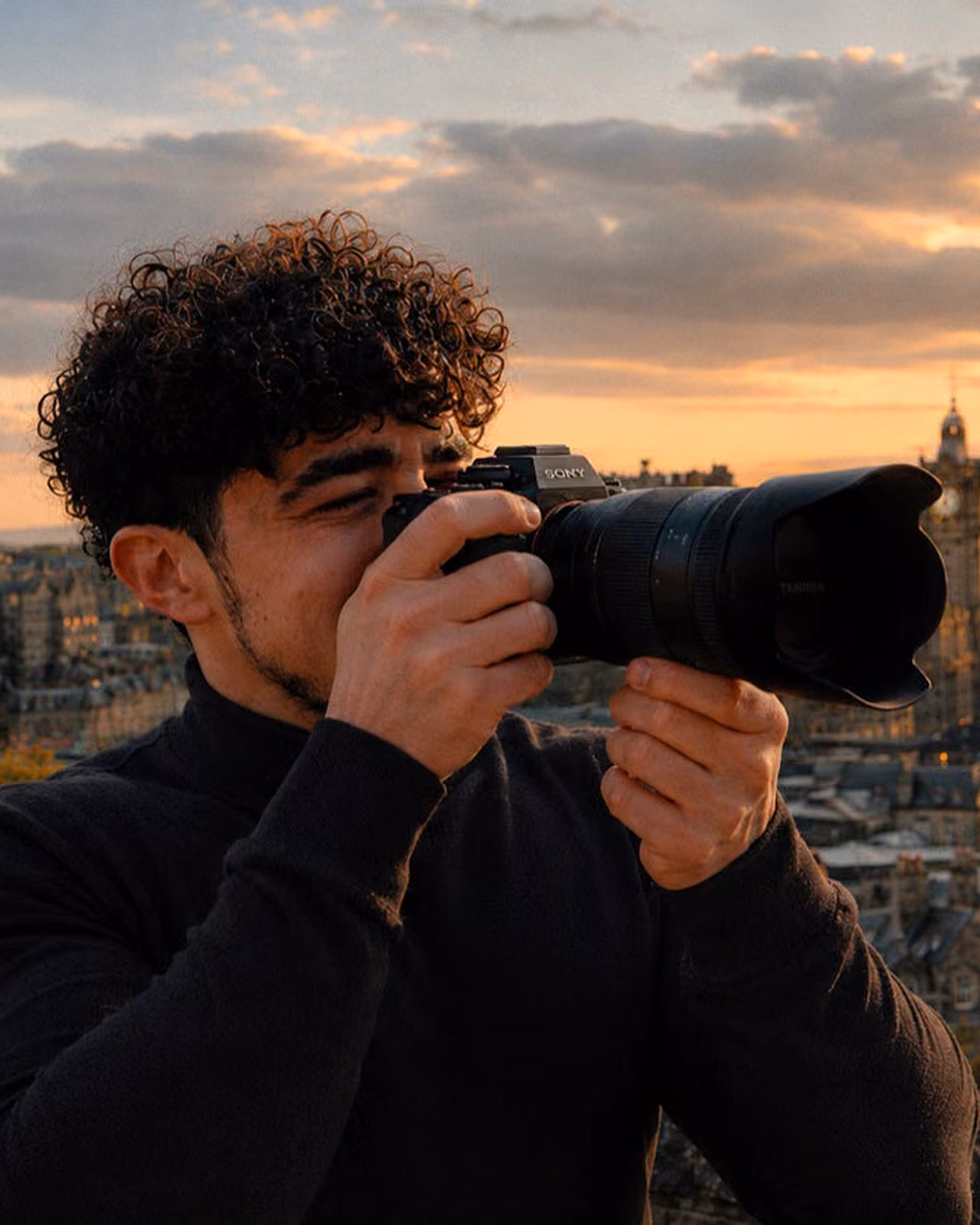 Gorka Di Capitan photographing the Edinburgh skyline at sunset from Calton Hill