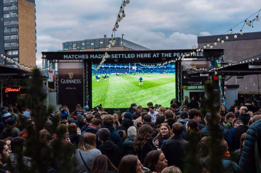 Packed beer garden watching the big screen at The Pear Tree, Edinburgh